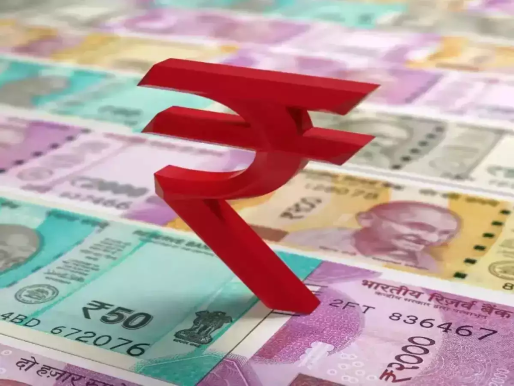 The Indian Rupee Slips 9 Paise To 77.17 Against US Dollar